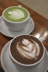 Two Cups of Hot Beverages: Hot Chocolate and Green Tea Latte