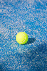 The beautiful texture of a padel court and a single ball. A Sunny Court Texture