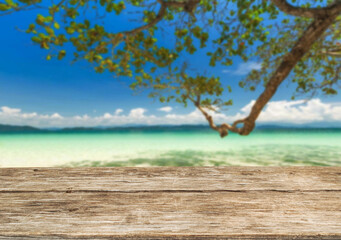 Wooden table top on the beach or sea.Party on the beach  sunshine time concept.For montage product display or design key visual layout.View of copy space.