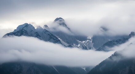 Majestic Mountain Peaks Emerging Through Ethereal Fog