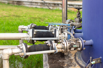 Industrial Pipeline System with Valves and Connectors Outdoors Depicting Fluid Control Distribution in a Factory Setting with Detailed Piping and Equipment for Engineering Applications