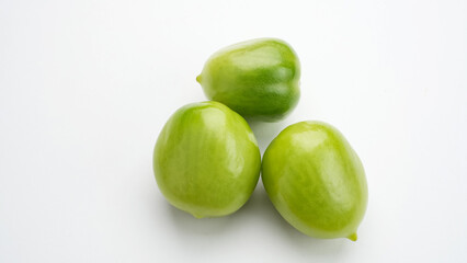 Fresh green tomatoes isolated on white background
