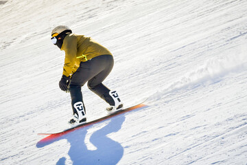 Close up zoom snowboarder isolated fast motion freeze on snowy slope in ski resort run