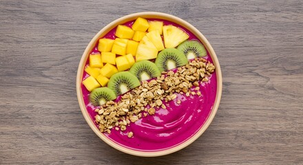 Dragon fruit smoothie bowl topped with granola and tropical fruits, wellness theme
