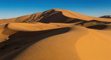 Vast desert dunes under a clear blue sky