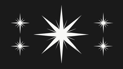 Abstract white starbursts and sparkles on a dark background
