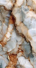 Close-up view of a textured, abstract marble.  Variations of beige, gold, and gray
