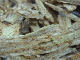 Sliced dried Ostericum koreanum (Ganghwal) root, known for its use in Korean medicine to relieve...