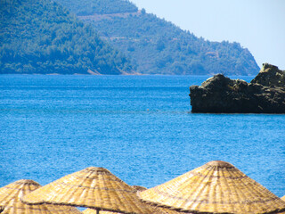 beach umbrellas on the sandy shore by the sea, summer vacation and seaside relaxation concept.