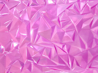 Fototapeta premium Background of pink glossy color is an abstract geometric pattern. Surface of textured three-dimensional decorative panel made of abstract geometric pattern resin with glossy finishing for decoration.