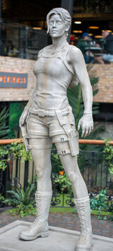 Statue of lara croft from tomb raider. Stone sculpture of famous video game character hero and movie film icon