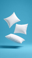 Three white pillows are levitating  in the air/ 
