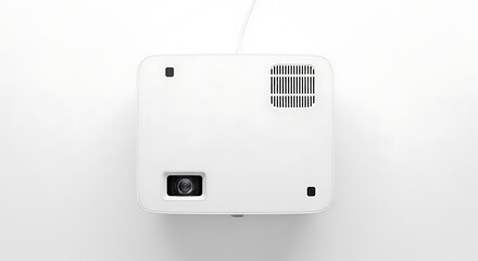 A top view of a white projector with a lens and a vent on a white background in a studio shot
