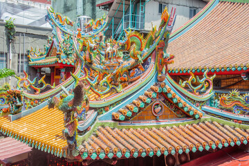 The roof of Taipei Mazu Temple, Taiwan, features intricate cut-and-paste ceramic sculptures. These...