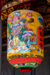 Fototapeta premium The traditional latern outside of Lungshan Temple in Taipei’s Wanhua District (also known as Monga) features traditional Chinese architecture with intricately carved wooden beams, colorful. 