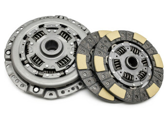 Naklejka premium Automotive clutch disc and pressure plate isolated on white background