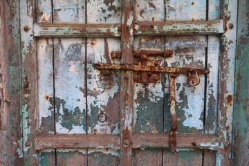old door and rusted lock in mattancherry street fort kochi