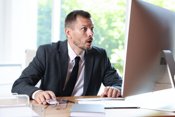 Businessman suffering from panic attack at workplace in office