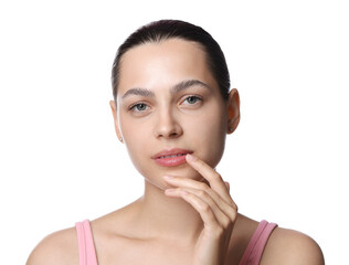 Young woman with lip balm on white background