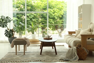 Coffee table, sofa, bench and decor in dining room. Interior design