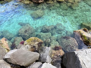 Crystal Clear Sea with Submerged Stones