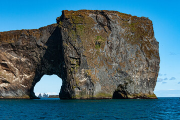 Dyrholaey is a 120 m high and precipitous headland. A large, natural gate has been eroded through its southernmost part. It is in south Iceland