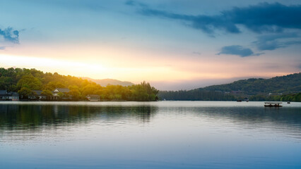 Beautiful Lake Scenery with Sunset Glow Over Calm Water