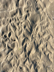 Natural sand pattern formed by retreating tide, perfect background