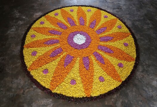 pookalam designs for onam celebrations , pookalam made for part of onam celibration in kerala, india. it also referred to as athapookalam, is often made in a circular shape with flowers on floor
