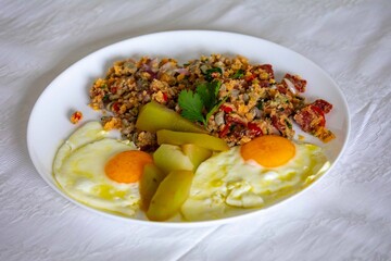 A traditional rustic Brazilian dish, known as Arrandinho, prepared with dried beef jerky, cassava...