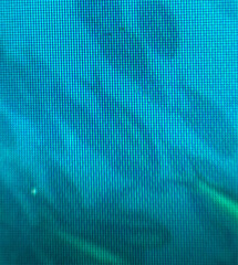 Close-up abstract texture of blue digital screen pixels. Ideal for backgrounds, tech designs, or...
