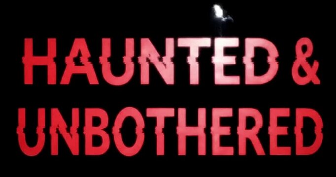 Haunted and unbothered text with glitch effect against a dark black background