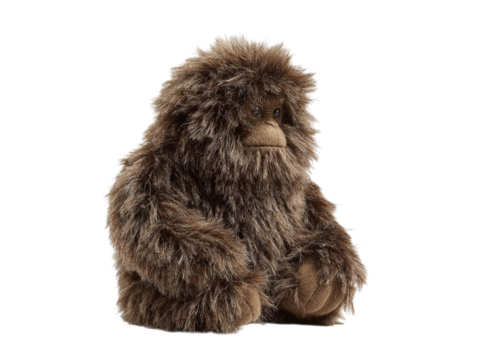 PNG of A fluffy brown plush gorilla toy sitting in a relaxed pose, showcasing soft textures and playful charm. - on Transparent or White BG