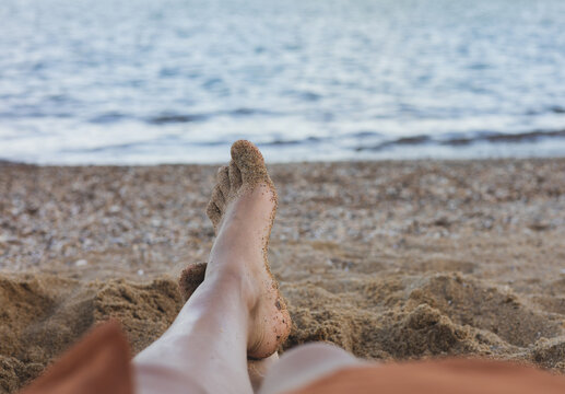 sandy feet on the beach - Powered by Adobe