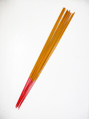 A bunch of traditional unlit incense on a white background. Ritual tools for the daily prayers of...