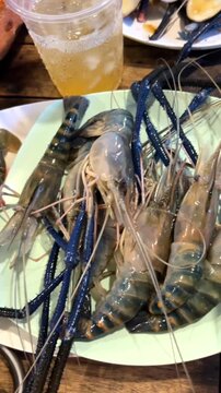 Seafood Buffet with Fresh Shrimp Crab Shellfish Grilled BBQ and Spicy Seafood Sauce.