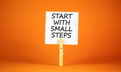 Start with small steps symbol. Concept words phrase Start with small steps on beautiful white paper...
