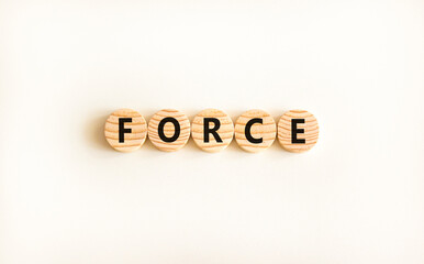 Force symbol. Concept word Force on beautiful wooden circles. Beautiful white table white background. Business lifestyle force concept. Copy space.