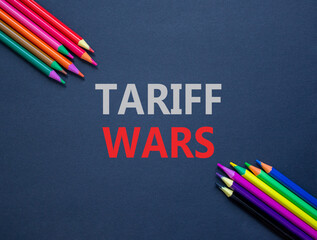 Trade tariff wars symbol. Concept word Tariff wars on beautiful black paper. Colored pencils. Beautiful black paper background. Business trade tariff wars concept concept. Copy space.