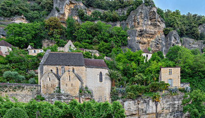 Rock church beneath the steep slopes in the Dordogne Valley in La Rouge-Cageac in the region...
