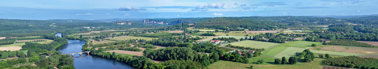 Panorama of the landscape with the Dordogne River below the municipality of Domme in the region...