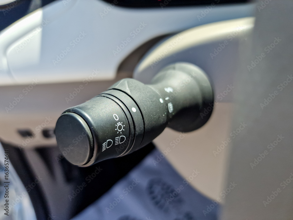 Poster this image showcases a closeup view of a cars control lever, which is specifically designed for mana
