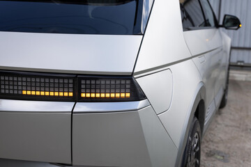 Car taillight. LED red taillight. Closeup tail light of a modern car. Rear light of a car. Rear...