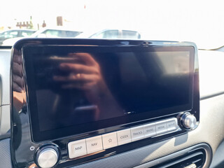 The modern car infotainment system features a sophisticated display and advanced controls...