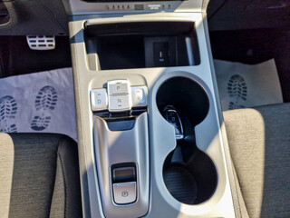 Introducing the modern vehicle center console designed with innovative storage solutions and cup...