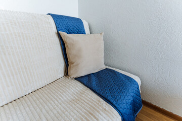 This cozy living room corner features soft textures and warm colors, designed for comfort and...