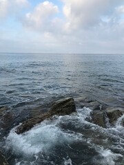 Rocky shore meeting turquoise Mediterranean waters.
