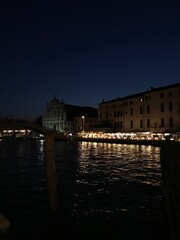 Venetian streets lit by traditional lanterns.
