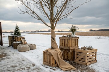Creating a rustic barn gift stand with wooden crates and a burlap-wrapped tree in a charming country setting