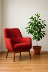 A vibrant red armchair invites relaxation beside a lush green potted plant, set against a minimalist white wall